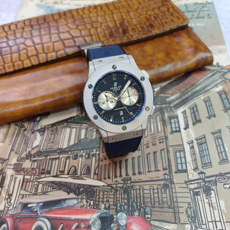 ساعت مچب عقربه ای آنالوگ برندHUBLOT مردانه تک موتور تاریخ شمار دار بند چرم قفل فیکسر پروانه ای